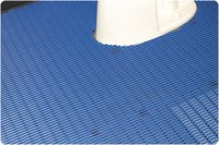Photo shows Posey sure-step cushioned mat custom cut around the base of toilet 